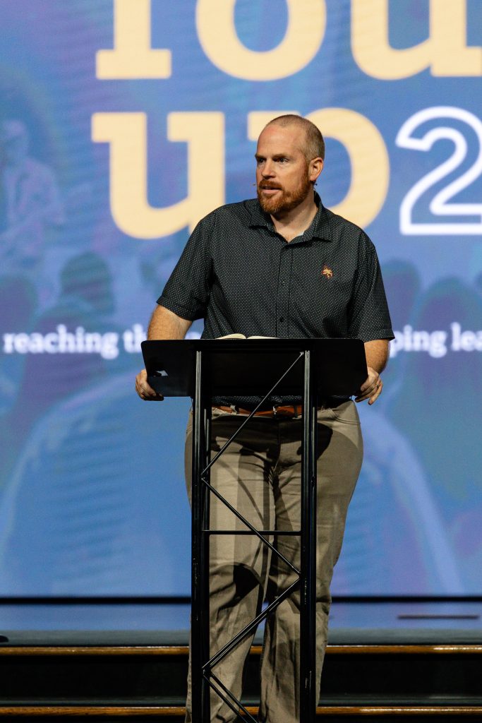 Chris Millar speaks from the lectern during SBTC Collegiate Roundup 2026.